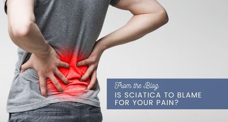 Person touching their lower back in pain.
