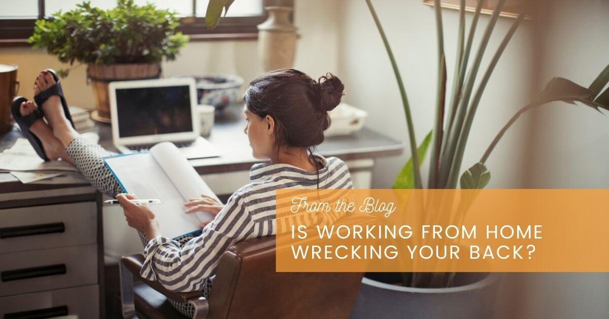 Woman sitting on exercise ball with proper posture while working from laptop at home.